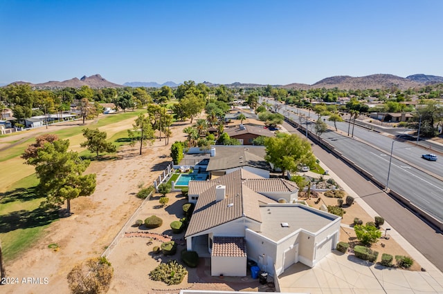 birds eye view of property with a mountain view