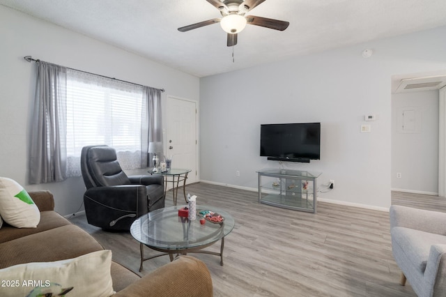 living room featuring ceiling fan and light hardwood / wood-style flooring