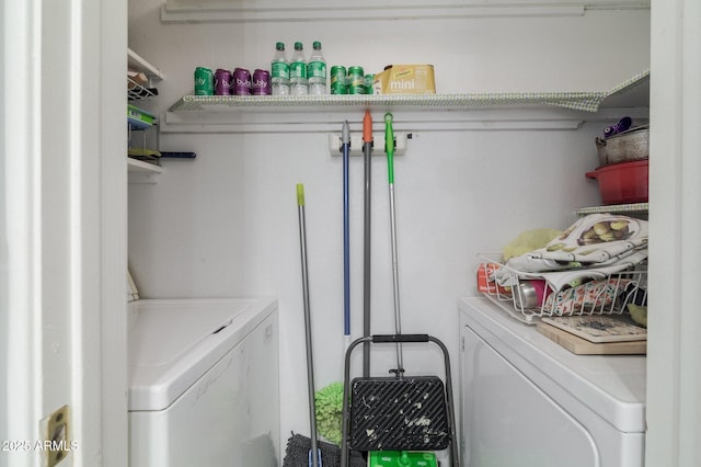 clothes washing area with washing machine and clothes dryer