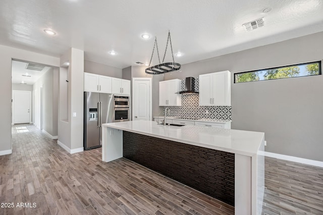 422 E Kaibab Pl, Chandler, AZ 85249 - kitchen with stainless steel appliances, light wood-type flooring, light countertops, and recessed lighting