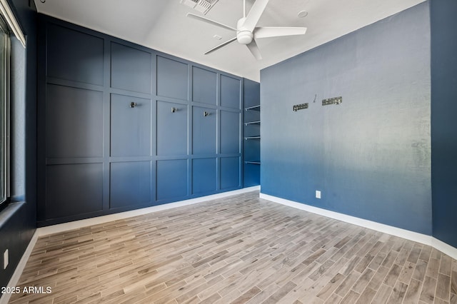 422 E Kaibab Pl, Chandler, AZ 85249 - spare room with a decorative wall, ceiling fan, and light wood-type flooring