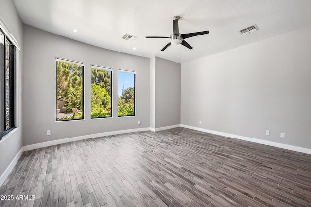 422 E Kaibab Pl, Chandler, AZ 85249 - spare room featuring wood finished floors, ceiling fan, and recessed lighting