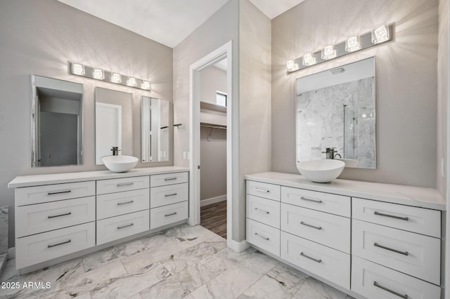 422 E Kaibab Pl, Chandler, AZ 85249 - full bath with marble look tiles, a marble finish shower, vanity, and a spacious closet