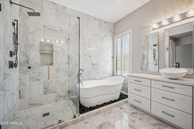 422 E Kaibab Pl, Chandler, AZ 85249 - bathroom featuring marble tiled floors, a marble finish shower, vanity, a soaking tub, and tile walls