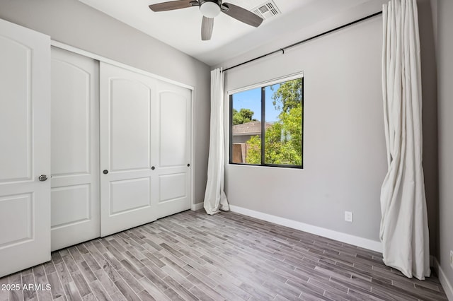 422 E Kaibab Pl, Chandler, AZ 85249 - unfurnished bedroom featuring light wood-type flooring, a closet, and ceiling fan