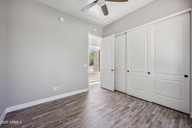 422 E Kaibab Pl, Chandler, AZ 85249 - unfurnished bedroom featuring wood finished floors, a closet, and ceiling fan