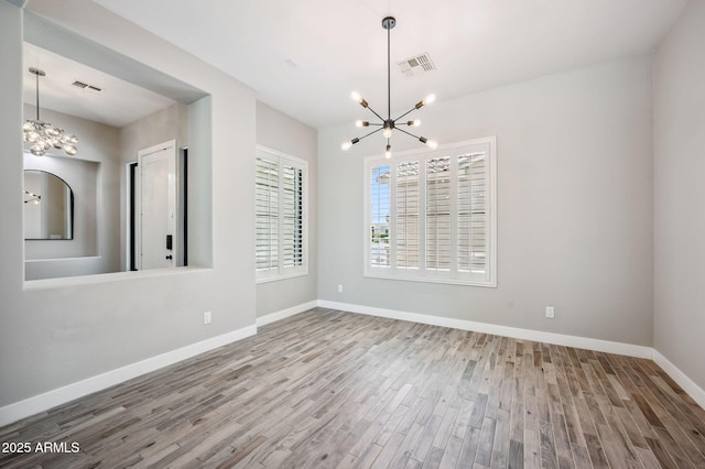 422 E Kaibab Pl, Chandler, AZ 85249 - unfurnished dining area with a chandelier and wood finished floors