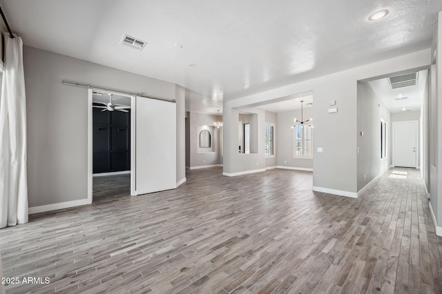 422 E Kaibab Pl, Chandler, AZ 85249 - unfurnished living room featuring a chandelier and wood finished floors