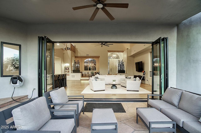 view of patio featuring ceiling fan and an outdoor living space