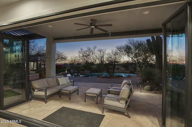 view of patio / terrace featuring ceiling fan and an outdoor living space