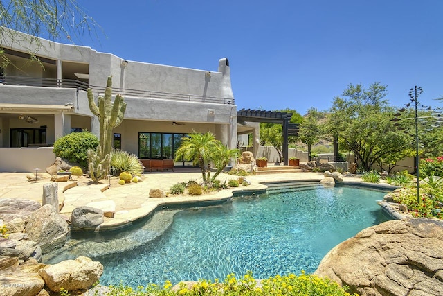 outdoor pool featuring ceiling fan, a patio area, fence, and a pergola