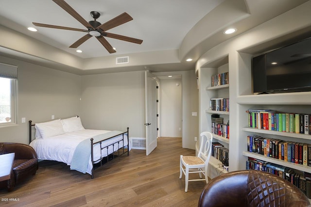 bedroom with ceiling fan, wood finished floors, visible vents, and recessed lighting