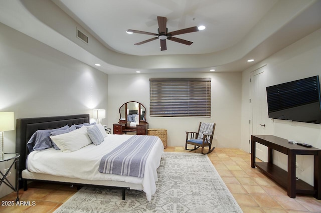 bedroom featuring visible vents, a raised ceiling, a ceiling fan, and recessed lighting