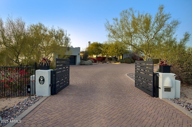 view of gate featuring fence