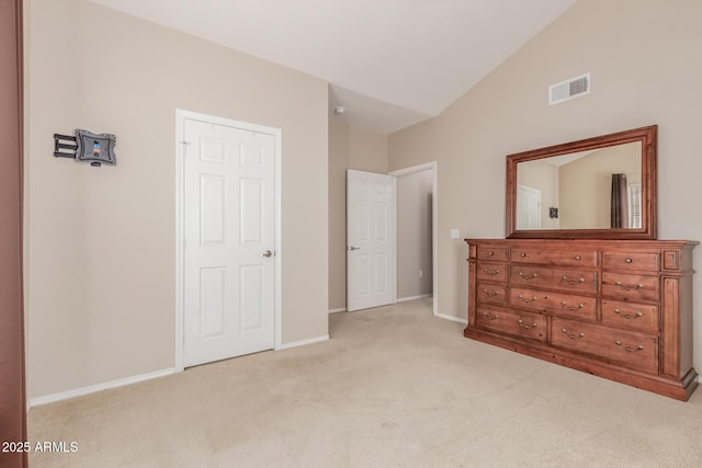 carpeted bedroom featuring lofted ceiling