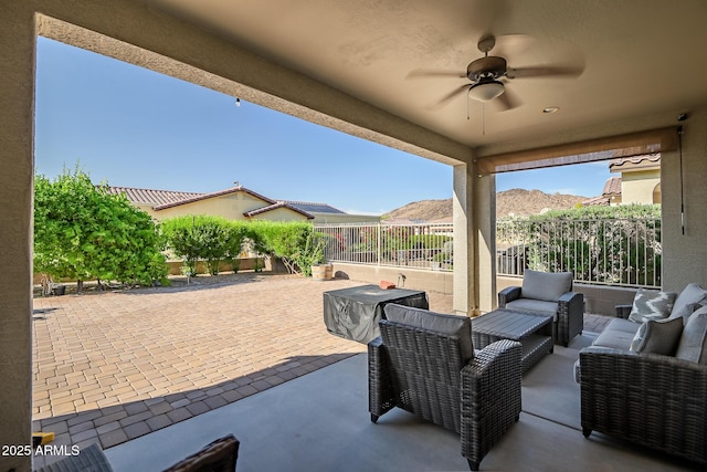view of patio / terrace featuring an outdoor hangout area, ceiling fan, and a fenced backyard