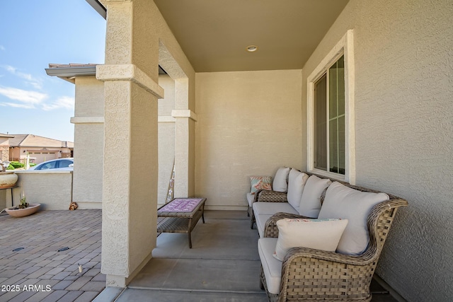 view of patio featuring a balcony