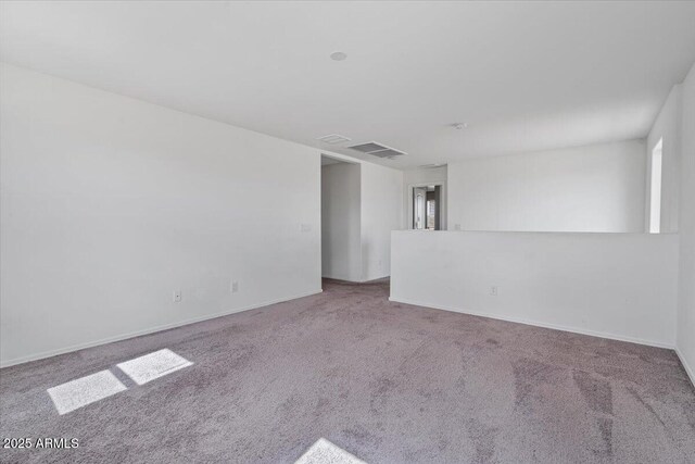 618 E Elm Ln, Avondale, AZ 85323 - empty room featuring carpet floors, visible vents, and baseboards