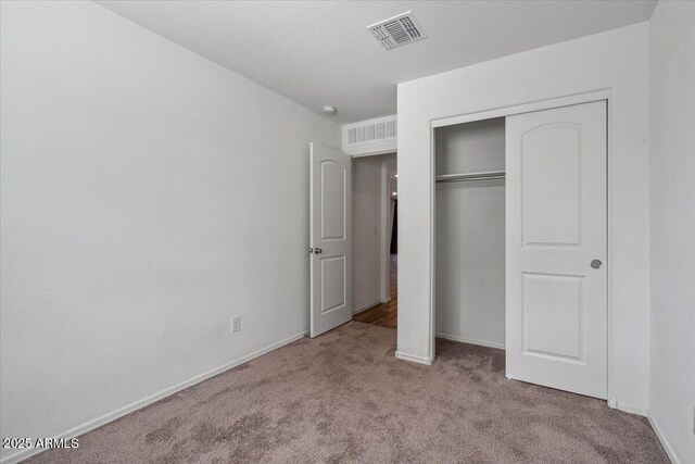 618 E Elm Ln, Avondale, AZ 85323 - unfurnished bedroom with carpet, a closet, visible vents, and baseboards