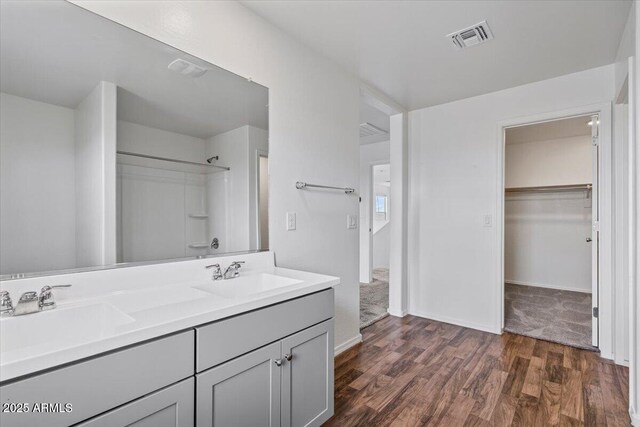 618 E Elm Ln, Avondale, AZ 85323 - full bath featuring visible vents, walk in shower, a sink, and wood finished floors