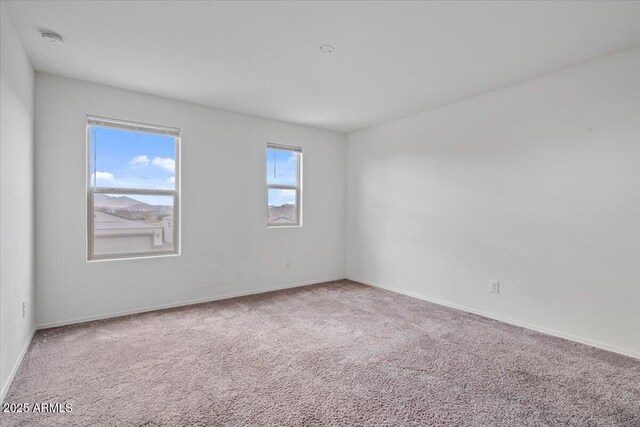618 E Elm Ln, Avondale, AZ 85323 - carpeted spare room featuring baseboards