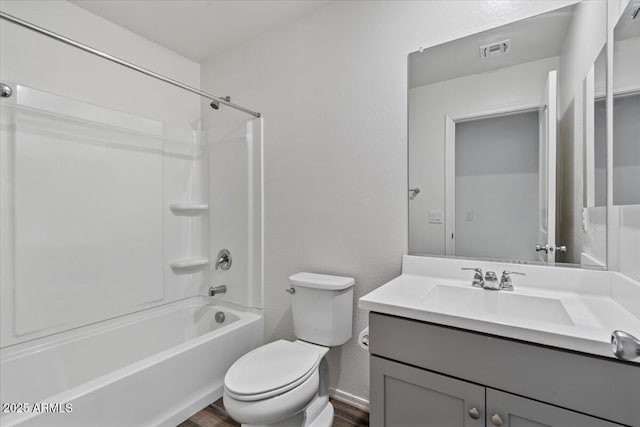 618 E Elm Ln, Avondale, AZ 85323 - bathroom featuring visible vents, bathing tub / shower combination, toilet, wood finished floors, and vanity
