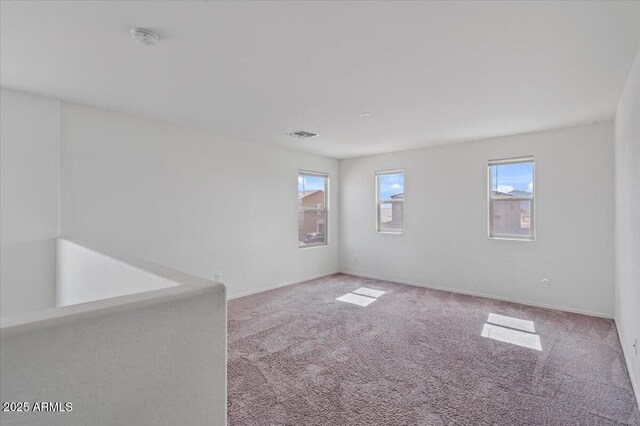 618 E Elm Ln, Avondale, AZ 85323 - carpeted spare room with plenty of natural light and baseboards