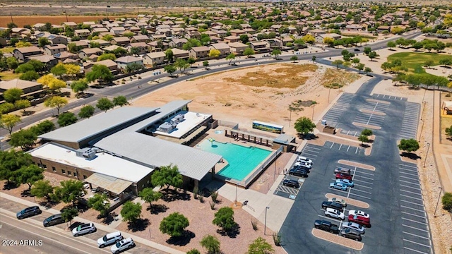 birds eye view of property with a residential view