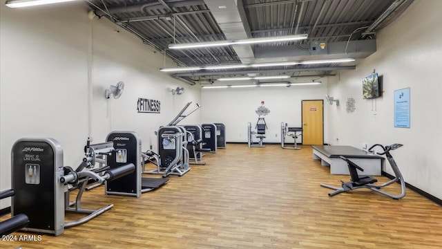 gym with wood finished floors