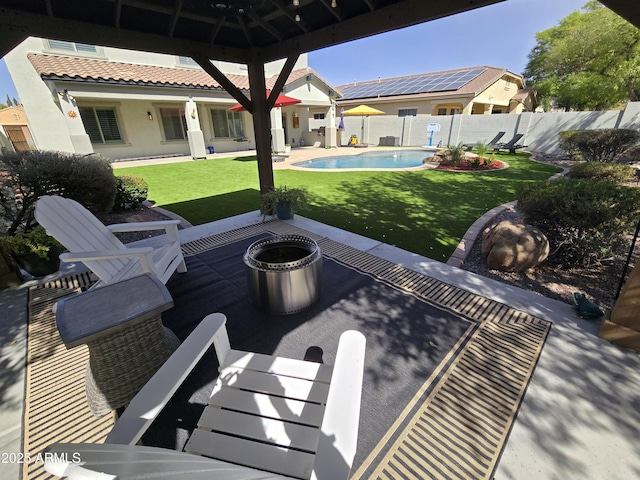 view of patio / terrace featuring a fenced in pool, an outdoor fire pit, and fence