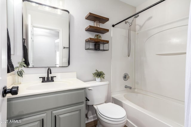 full bath with vanity, toilet, and bathing tub / shower combination