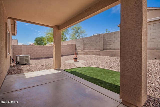 view of patio / terrace featuring a fenced backyard and central AC unit