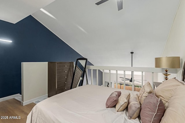 bedroom featuring vaulted ceiling, ceiling fan, and light hardwood / wood-style floors