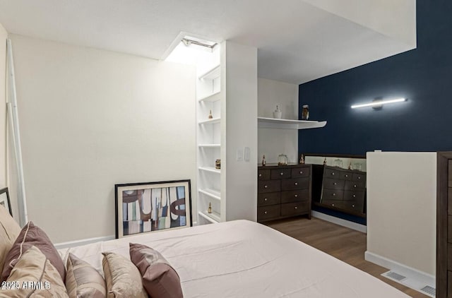 bedroom featuring dark wood-type flooring