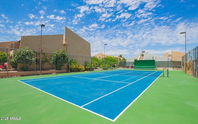 view of sport court with basketball hoop