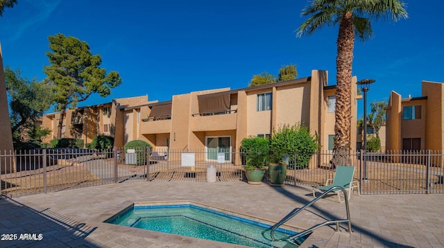 view of pool featuring a hot tub