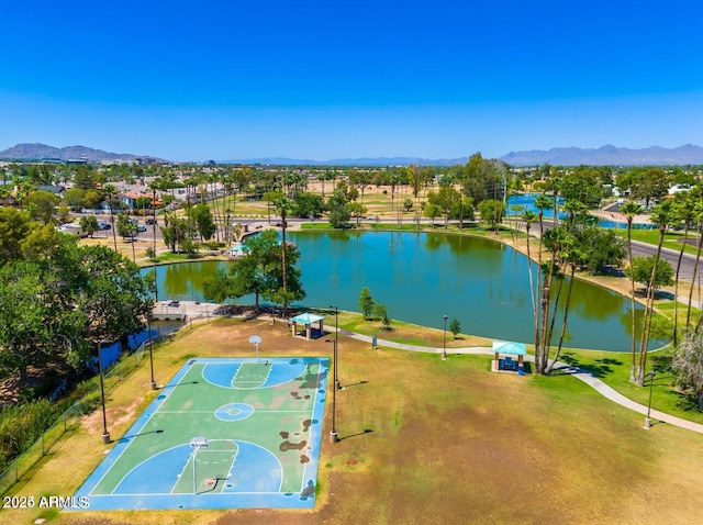 drone / aerial view featuring a water and mountain view