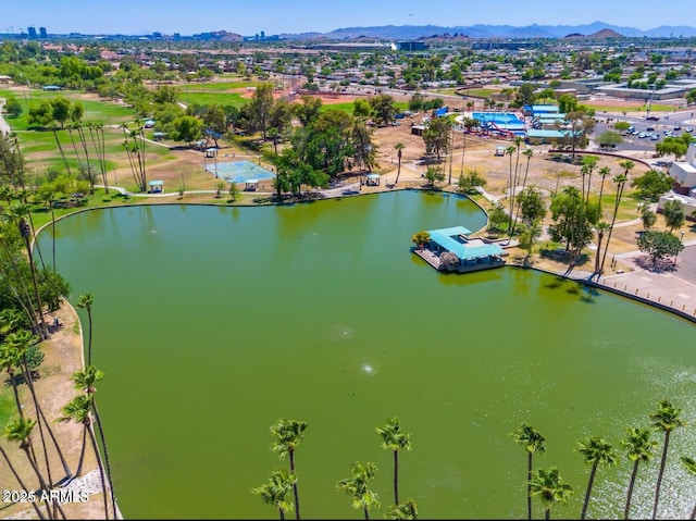 drone / aerial view with a water and mountain view