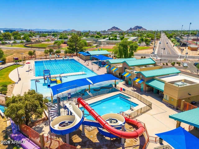 view of pool featuring a mountain view and a water slide