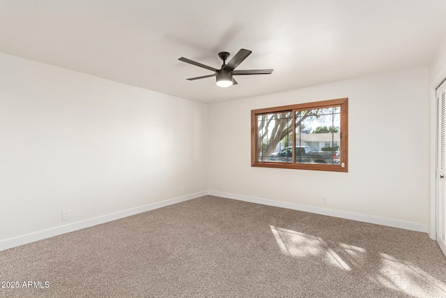 carpeted empty room with ceiling fan