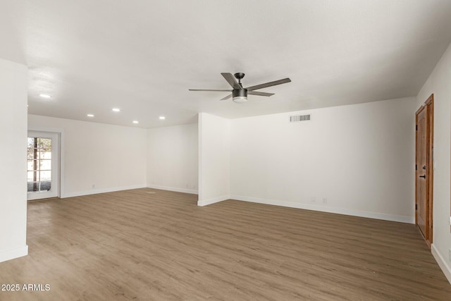 unfurnished room featuring light hardwood / wood-style floors and ceiling fan