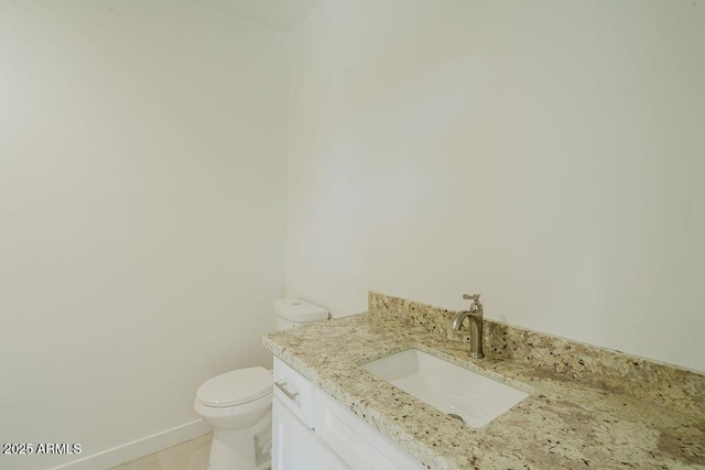 bathroom with toilet and vanity