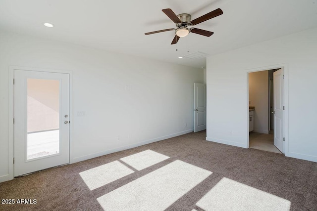 carpeted empty room featuring ceiling fan