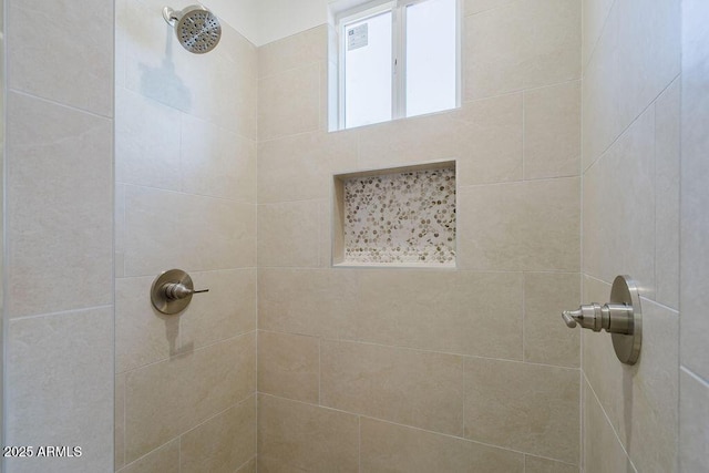 bathroom with tiled shower