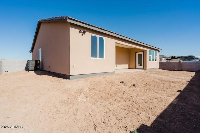 back of house featuring cooling unit and a patio