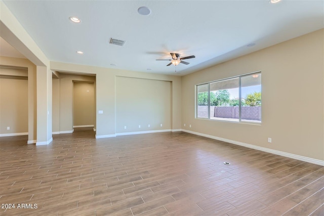 spare room with ceiling fan and light hardwood / wood-style flooring