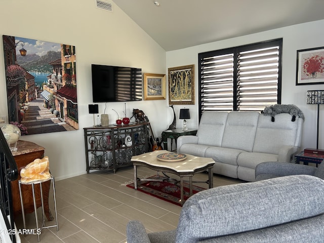 living room with lofted ceiling