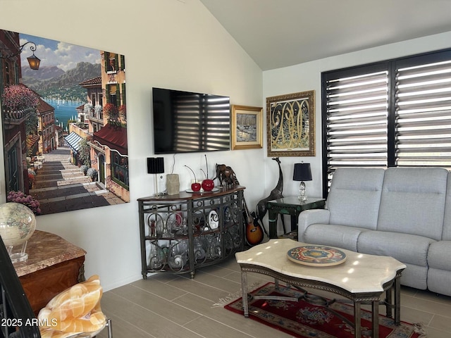 living room with lofted ceiling and a fireplace