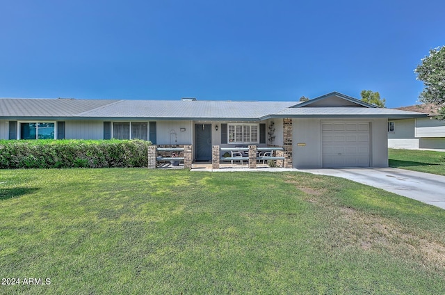 single story home with a garage and a front yard