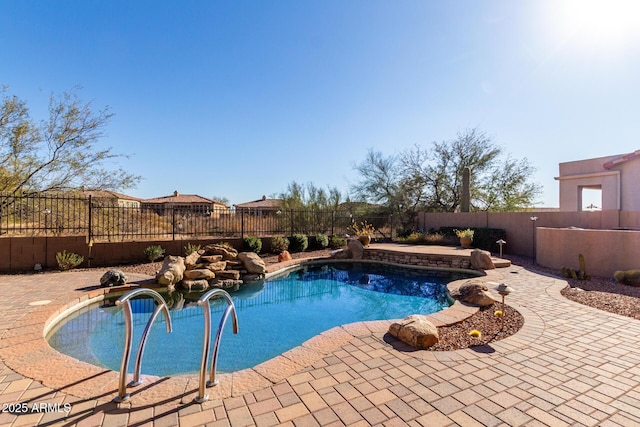 view of swimming pool featuring a fenced backyard, a fenced in pool, and a patio